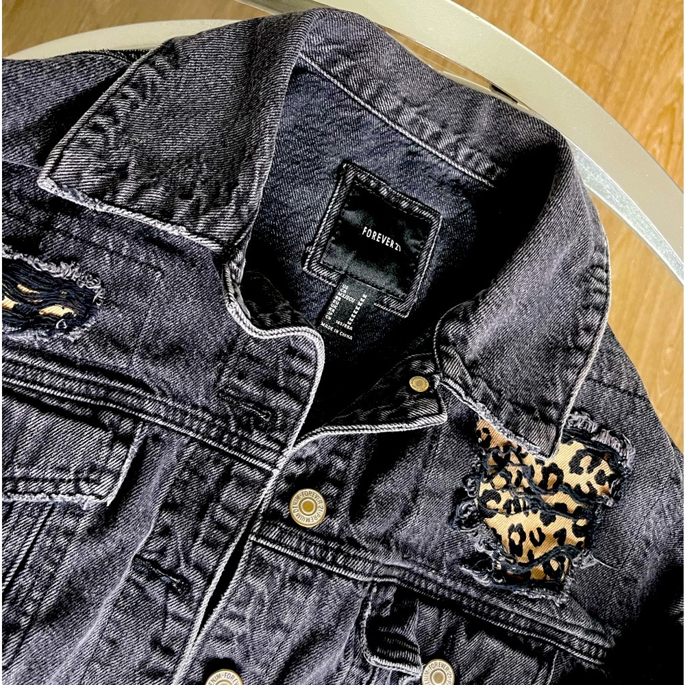 Slightly cropped distressed cheetah jean jacket
